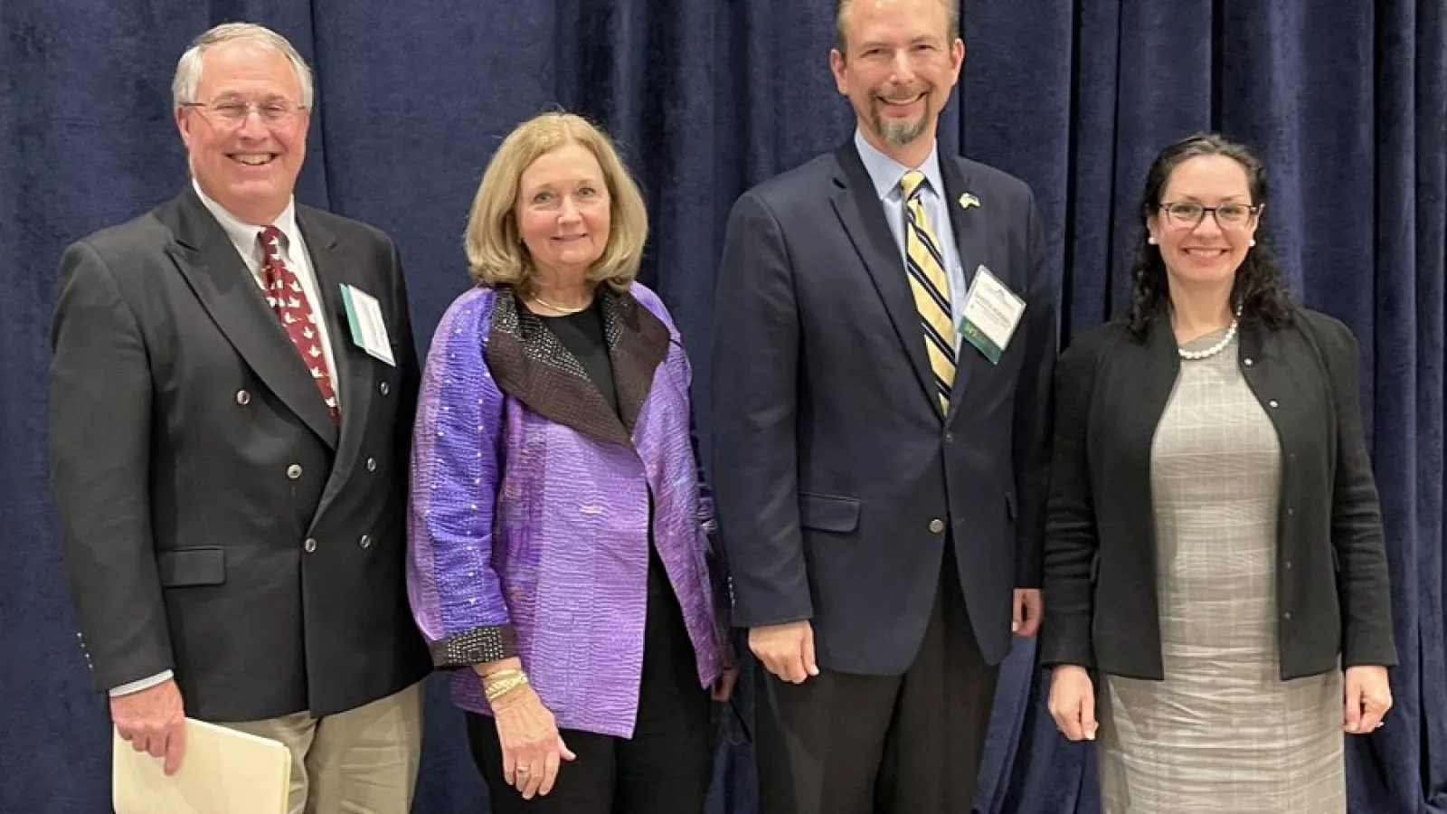 Dakota Rudesill stands next to his panelists. 