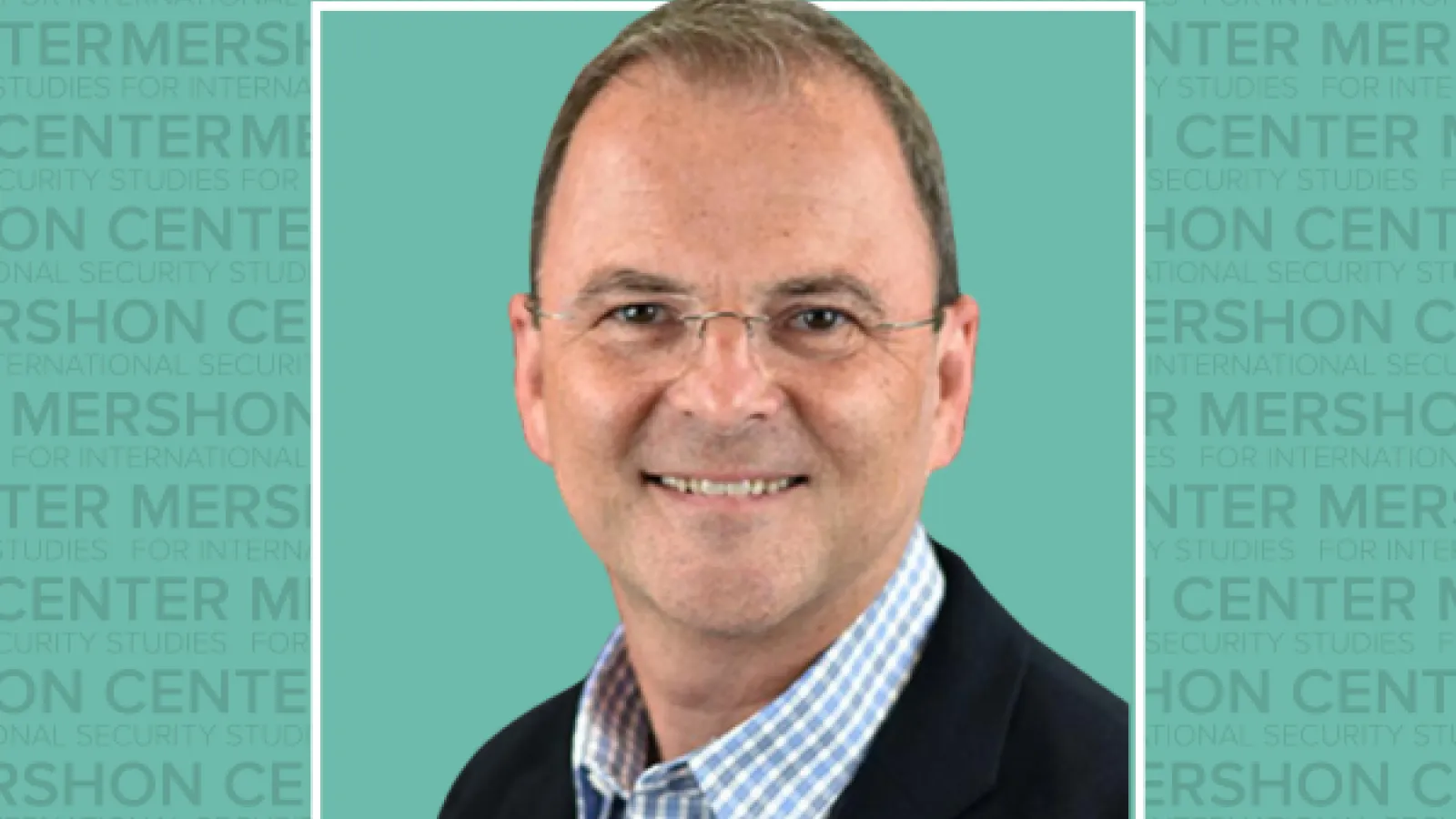 Chris Gelpi wearing glasses in a suit