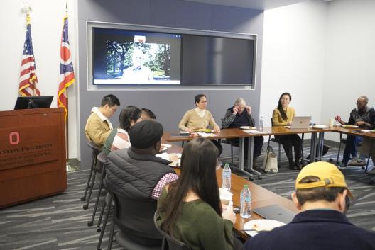 People talking at a conference table