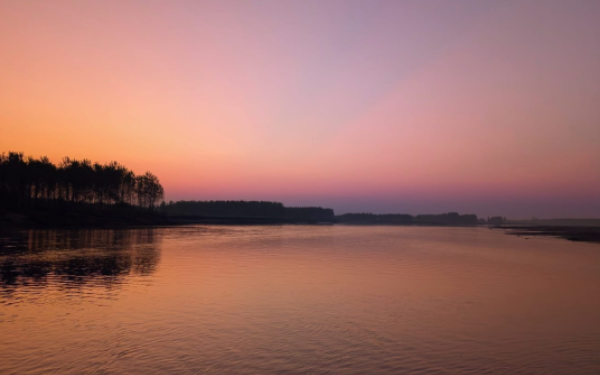 Pink and purple sunset above the Ravi River