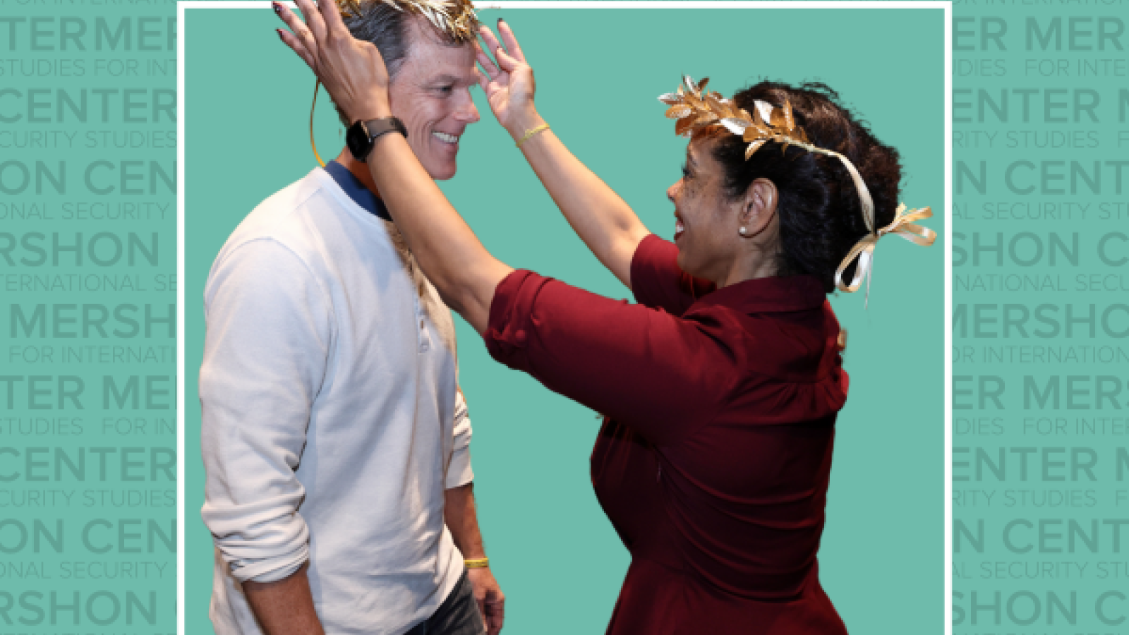 To celebrate his selection as the next Artist Laureate, Kevin McClatchy receives a gold wreath from current Artist Laureate Nyama McCarthy-Brown.