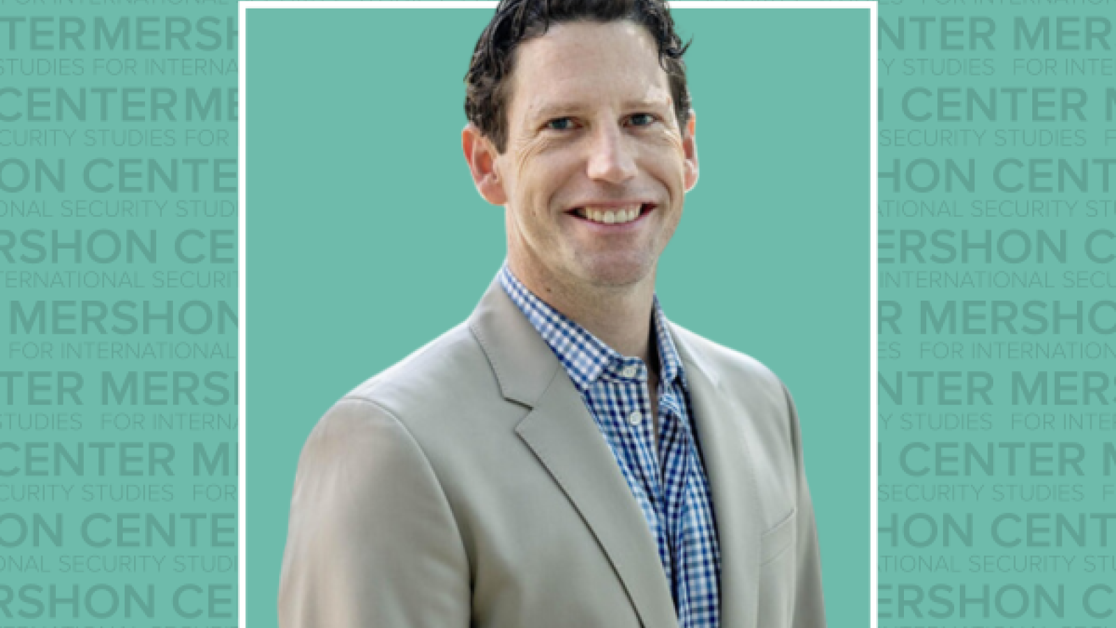 Photo of Chris Nichols in a tan suit on a teal background with repeating Mershon Center text.