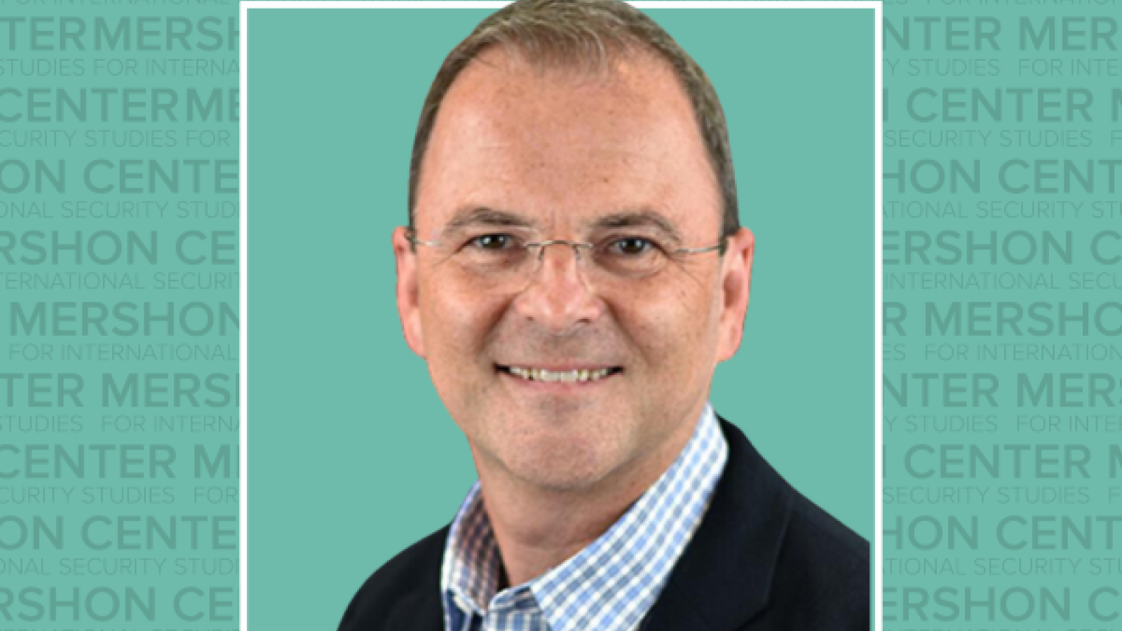 Chris Gelpi wearing glasses in a suit
