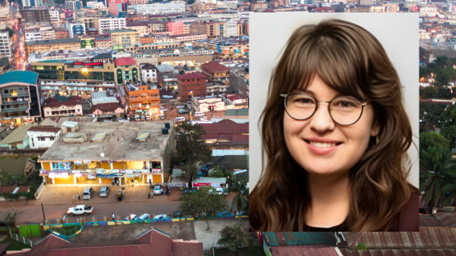 Erin Moore with Kampala, Uganda in the background